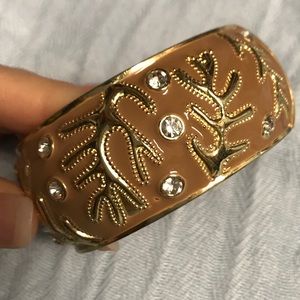 Gold tone and enamel hinge bangle bracelet